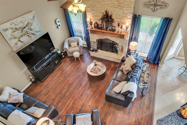 156 Buckskin Dr, Van Alstyne, TX 75495 - living area with a stone fireplace, ceiling fan, and wood finished floors