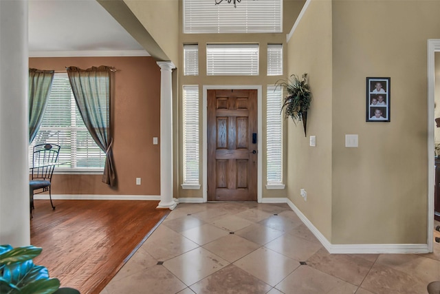 156 Buckskin Dr, Van Alstyne, TX 75495 - tiled entrance foyer featuring ornate columns and a towering ceiling