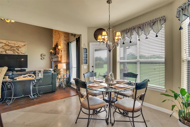 156 Buckskin Dr, Van Alstyne, TX 75495 - tiled dining area featuring a chandelier and baseboards