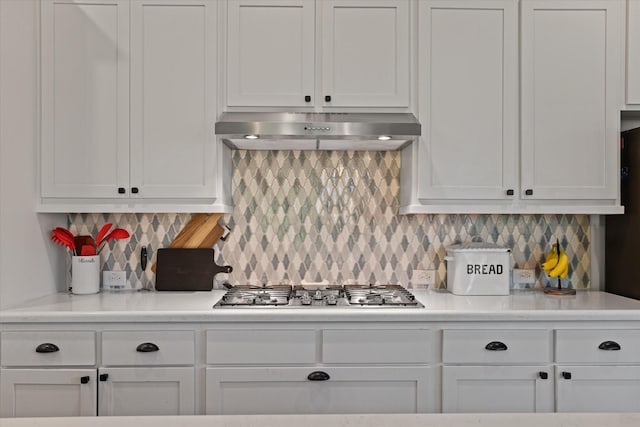 3204 Maplewood Dr, Mckinney, TX 75071 - kitchen with under cabinet range hood, white cabinets, stainless steel gas cooktop, and light countertops