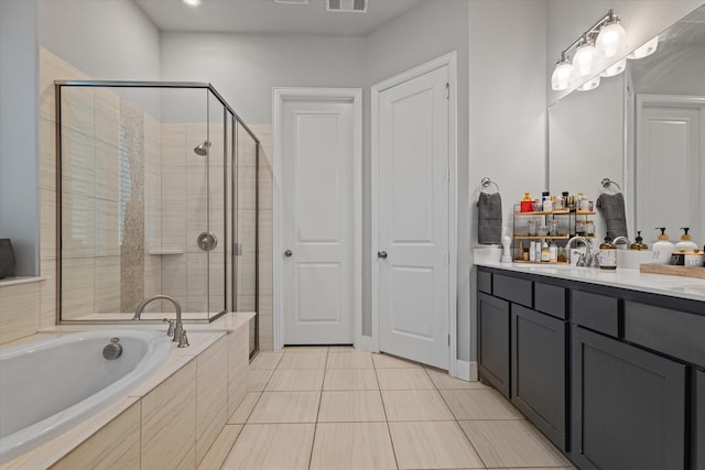 3204 Maplewood Dr, Mckinney, TX 75071 - bathroom with double vanity, a shower stall, a bath, and tile patterned floors