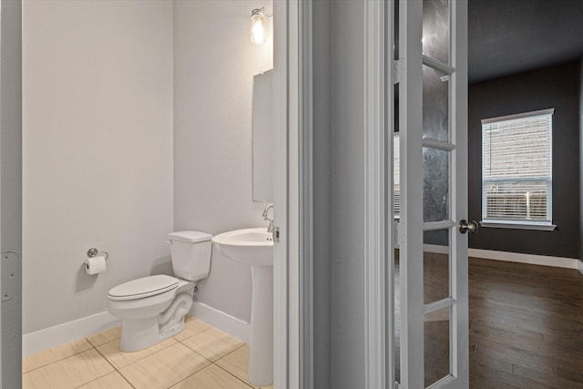3204 Maplewood Dr, Mckinney, TX 75071 - half bathroom with baseboards and tile patterned flooring