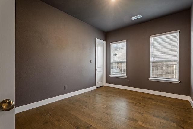 3204 Maplewood Dr, Mckinney, TX 75071 - spare room with dark wood-style floors and baseboards