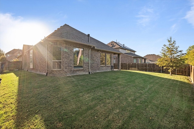 3204 Maplewood Dr, Mckinney, TX 75071 - back of house with brick siding, a fenced backyard, and a shingled roof