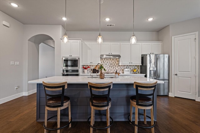 3204 Maplewood Dr, Mckinney, TX 75071 - kitchen featuring stainless steel appliances, backsplash, a center island with sink, white cabinets, and light countertops