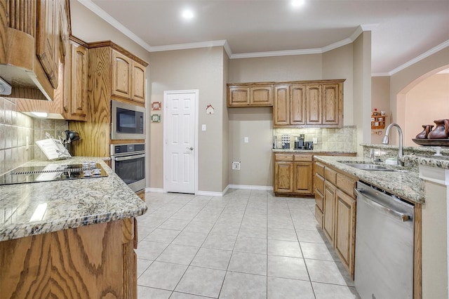 2134 Lorrie Ln, Weatherford, TX 76087 - kitchen with appliances with stainless steel finishes, a sink, light stone counters, decorative backsplash, and arched walkways
