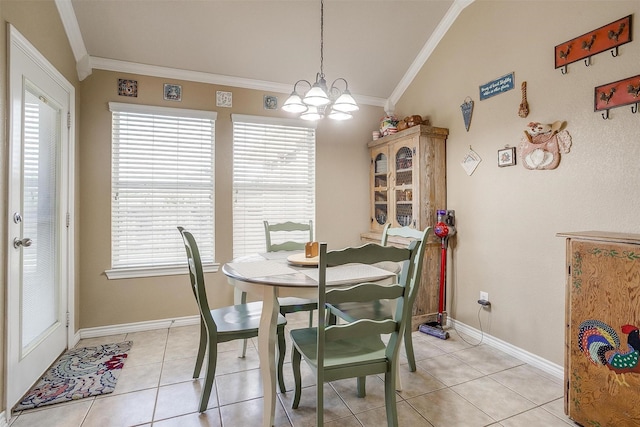 2134 Lorrie Ln, Weatherford, TX 76087 - dining space with ornamental molding, light tile patterned floors, a chandelier, baseboards, and vaulted ceiling