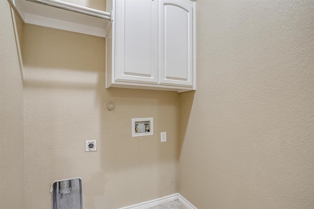 2134 Lorrie Ln, Weatherford, TX 76087 - laundry room with hookup for a washing machine, hookup for an electric dryer, baseboards, hookup for a gas dryer, and cabinet space