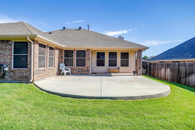 2134 Lorrie Ln, Weatherford, TX 76087 - back of house with brick siding, a patio area, a shingled roof, and a chimney
