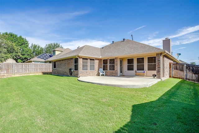 2134 Lorrie Ln, Weatherford, TX 76087 - rear view of property featuring brick siding, a patio area, a chimney, and a shingled roof
