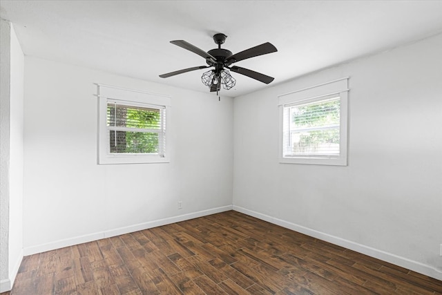 650 Minnie St, Stephenville, TX 76401 - spare room with plenty of natural light, dark wood-style floors, and baseboards