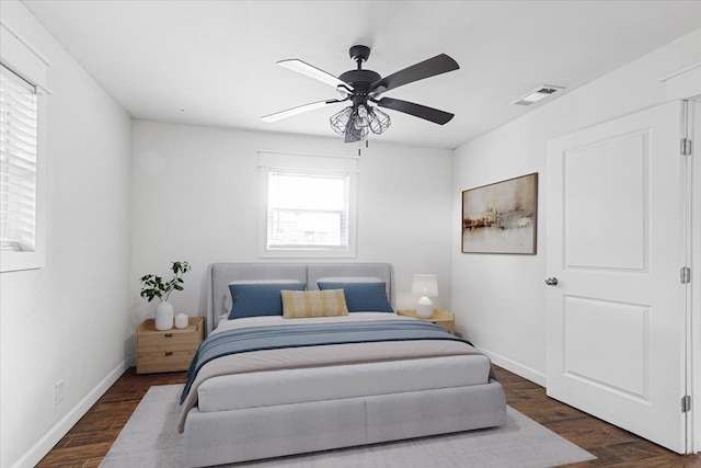 650 Minnie St, Stephenville, TX 76401 - bedroom with dark wood-style floors, baseboards, and a ceiling fan