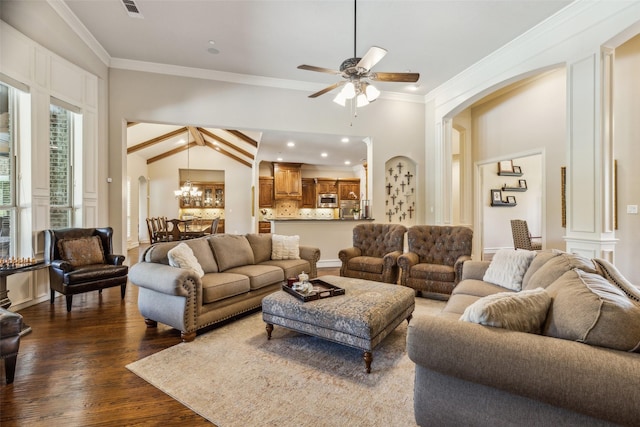 305 Crestfield Ct, Sunnyvale, TX 75182 - living room with arched walkways, ornamental molding, a ceiling fan, dark wood-style flooring, and a chandelier