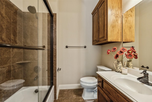 305 Crestfield Ct, Sunnyvale, TX 75182 - full bathroom featuring toilet, vanity, combined bath / shower with glass door, baseboards, and tile patterned floors