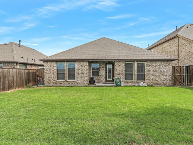 505 Maverick St, Anna, TX 75409 - rear view of property with a shingled roof, brick siding, and a patio