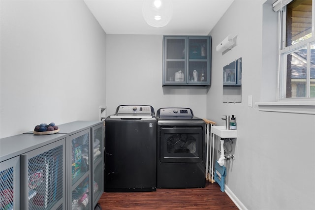 2118 Wooded Acres Dr, Waco, TX 76710 - washroom with separate washer and dryer, dark wood-style flooring, and baseboards