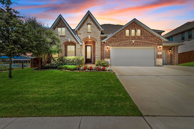 612 Wildriver Trl, Fort Worth, TX 76131 - view of front of property with an attached garage, brick siding, driveway, and stone siding