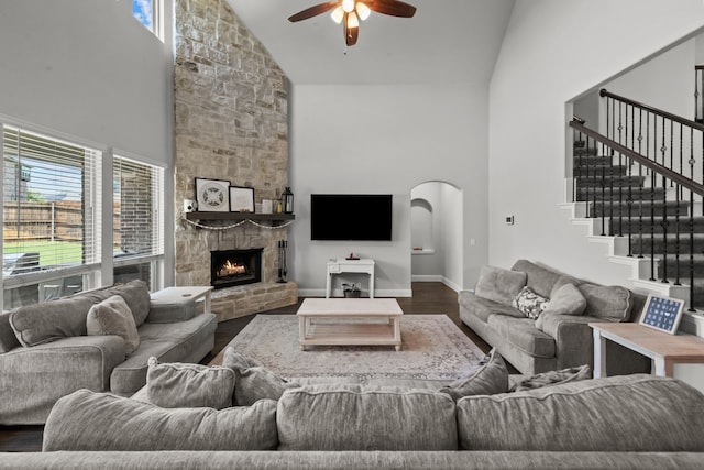 612 Wildriver Trl, Fort Worth, TX 76131 - living room with high vaulted ceiling, a ceiling fan, wood finished floors, a fireplace, and stairs