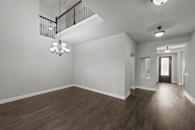 612 Wildriver Trl, Fort Worth, TX 76131 - entrance foyer with a chandelier, dark wood-style floors, and baseboards