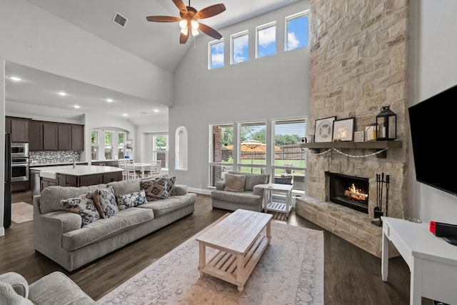 612 Wildriver Trl, Fort Worth, TX 76131 - living area with a ceiling fan, a stone fireplace, dark wood finished floors, recessed lighting, and high vaulted ceiling