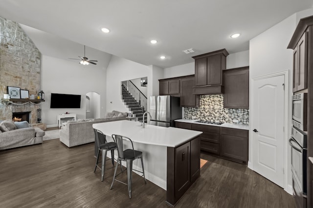 612 Wildriver Trl, Fort Worth, TX 76131 - kitchen featuring open floor plan, stainless steel appliances, ceiling fan, a kitchen bar, and an island with sink