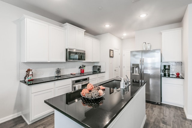 1129 Rusk Way, Lewisville, TX 75077 - kitchen featuring stainless steel appliances, a sink, dark countertops, decorative backsplash, and dark wood-style flooring