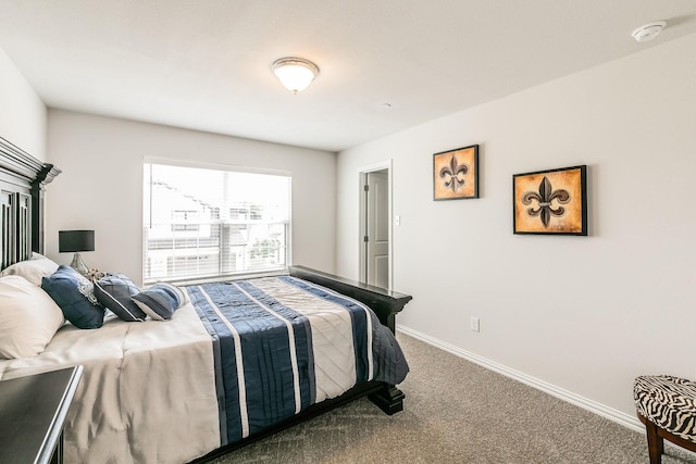 1129 Rusk Way, Lewisville, TX 75077 - carpeted bedroom featuring baseboards