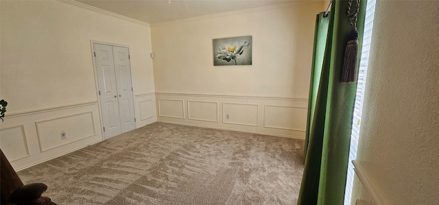 5632 Centeridge Dr, Dallas, TX 75249 - empty room with crown molding, carpet floors, a decorative wall, and wainscoting