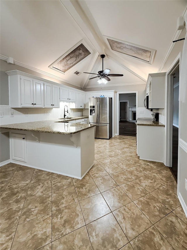 107 Summit Dr, Bossier City, LA 71111 - kitchen with appliances with stainless steel finishes, a peninsula, light stone countertops, ceiling fan, and white cabinetry