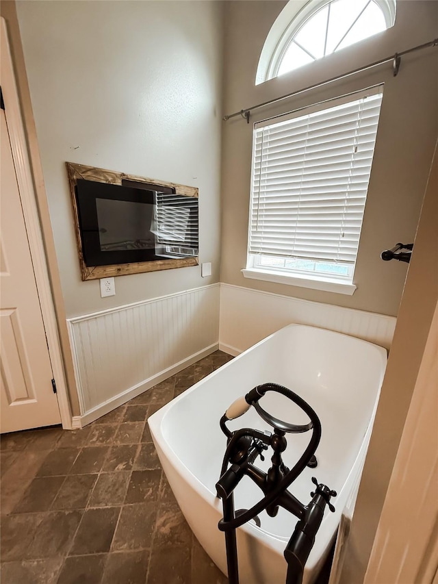 107 Summit Dr, Bossier City, LA 71111 - bathroom featuring a wainscoted wall and a freestanding bath