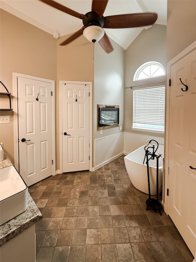 107 Summit Dr, Bossier City, LA 71111 - bathroom with a freestanding bath, vanity, high vaulted ceiling, heating unit, and a ceiling fan