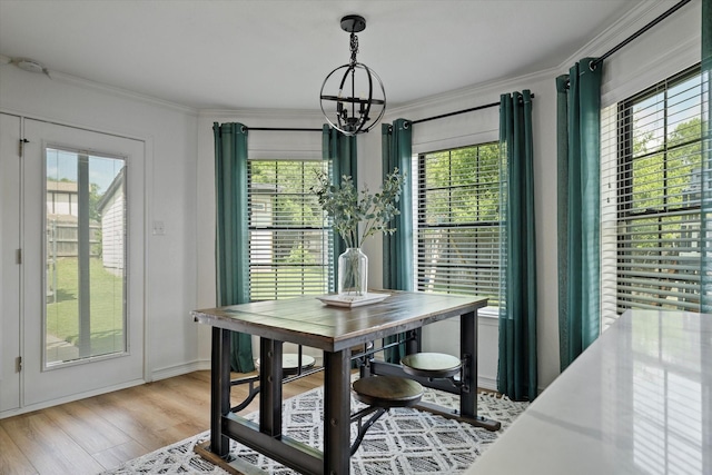 7204 Kingswood Dr, Fort Worth, TX 76133 - dining space with a chandelier, healthy amount of natural light, ornamental molding, and light wood finished floors