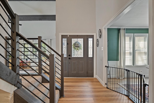 7204 Kingswood Dr, Fort Worth, TX 76133 - foyer entrance with wood finished floors, healthy amount of natural light, a high ceiling, and stairs