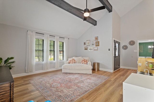 7204 Kingswood Dr, Fort Worth, TX 76133 - living area with high vaulted ceiling, beamed ceiling, baseboards, light wood-type flooring, and a ceiling fan