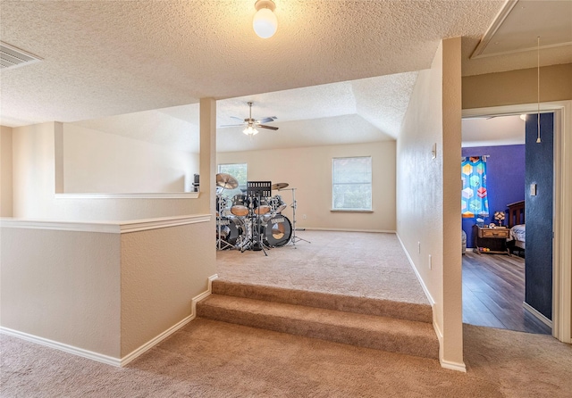 4406 Westcreek Ln, Sachse, TX 75048 - stairway featuring carpet, attic access, a textured ceiling, ceiling fan, and a textured wall