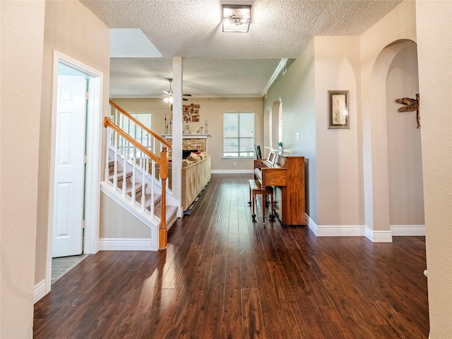 4406 Westcreek Ln, Sachse, TX 75048 - hall with a textured ceiling, hardwood / wood-style flooring, baseboards, stairway, and ornamental molding