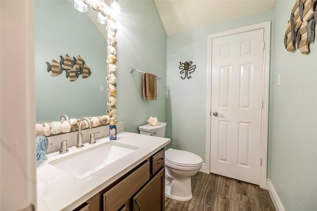 4406 Westcreek Ln, Sachse, TX 75048 - half bathroom with toilet, vanity, wood finished floors, and lofted ceiling