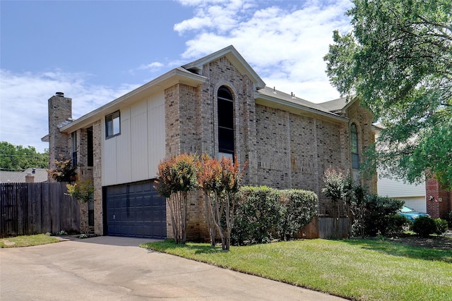 5630 Cancun Dr, North Richland Hills, TX 76180 - view of front of property with brick siding, a garage, concrete driveway, and a chimney