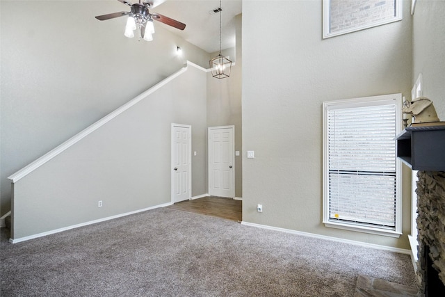 5630 Cancun Dr, North Richland Hills, TX 76180 - unfurnished living room featuring carpet floors, high vaulted ceiling, ceiling fan, stairs, and baseboards