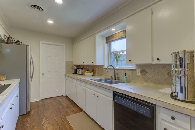 4200 Bilglade Rd, Fort Worth, TX 76109 - kitchen with dishwasher, a sink, white cabinetry, dark wood-style floors, and backsplash