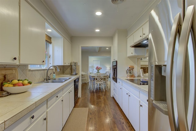 4200 Bilglade Rd, Fort Worth, TX 76109 - kitchen featuring black appliances, a sink, dark wood-style flooring, white cabinetry, and decorative backsplash