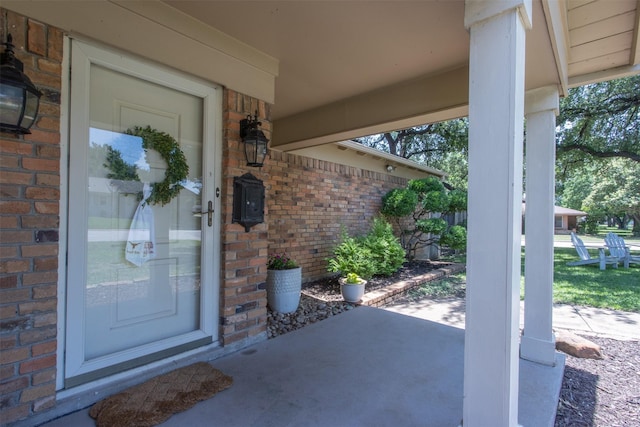 4200 Bilglade Rd, Fort Worth, TX 76109 - doorway to property featuring brick siding and covered porch