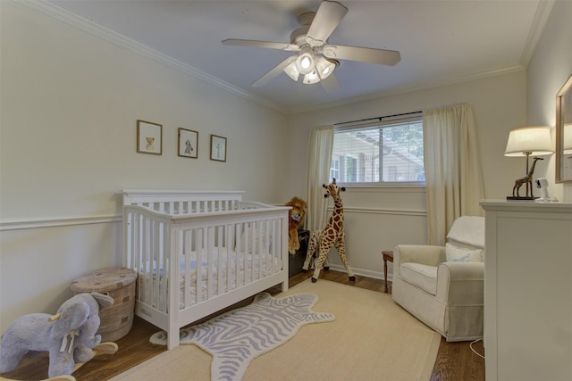 4200 Bilglade Rd, Fort Worth, TX 76109 - bedroom featuring wood finished floors, ornamental molding, a ceiling fan, baseboards, and a crib