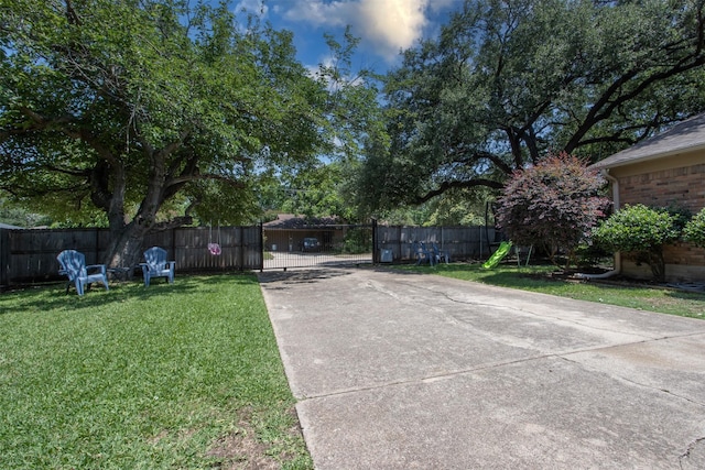 4200 Bilglade Rd, Fort Worth, TX 76109 - view of yard featuring concrete driveway and a gate