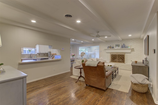 4200 Bilglade Rd, Fort Worth, TX 76109 - living room featuring ceiling fan, dark wood-type flooring, beam ceiling, recessed lighting, and a brick fireplace