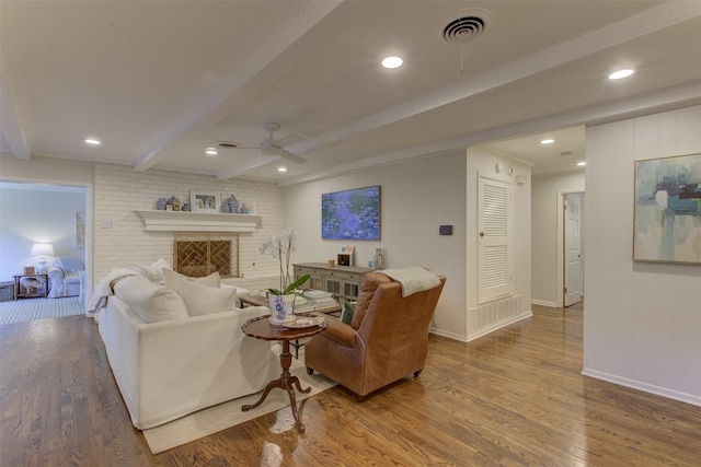 4200 Bilglade Rd, Fort Worth, TX 76109 - living room with beam ceiling, wood finished floors, a ceiling fan, baseboards, and a brick fireplace