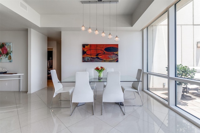 3111 Welborn St Unit 1303, Dallas, TX 75219 - dining area with tile patterned flooring
