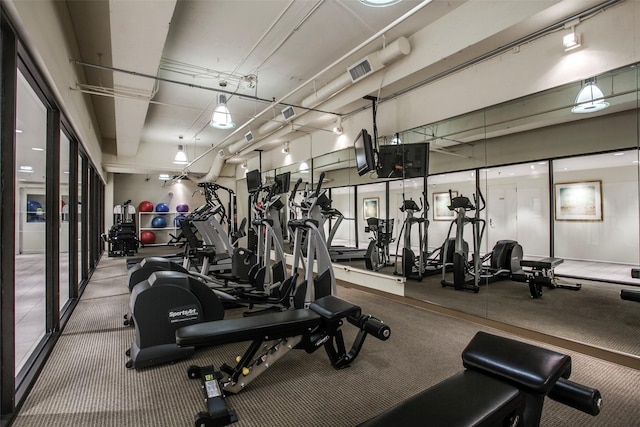 3111 Welborn St Unit 1303, Dallas, TX 75219 - gym featuring carpet flooring