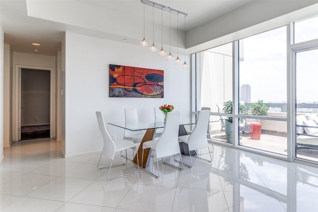 3111 Welborn St Unit 1303, Dallas, TX 75219 - dining space with baseboards and light tile patterned flooring