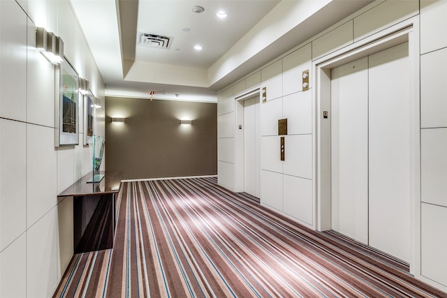 3111 Welborn St Unit 1303, Dallas, TX 75219 - hall featuring elevator, carpet, and recessed lighting